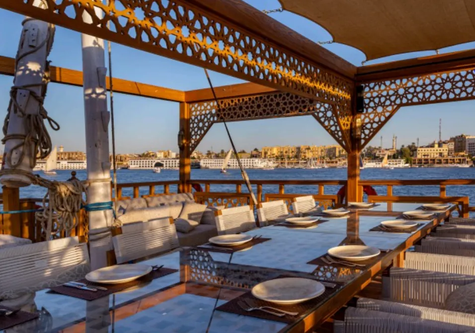 Shaded deck dining overlooking the Nile